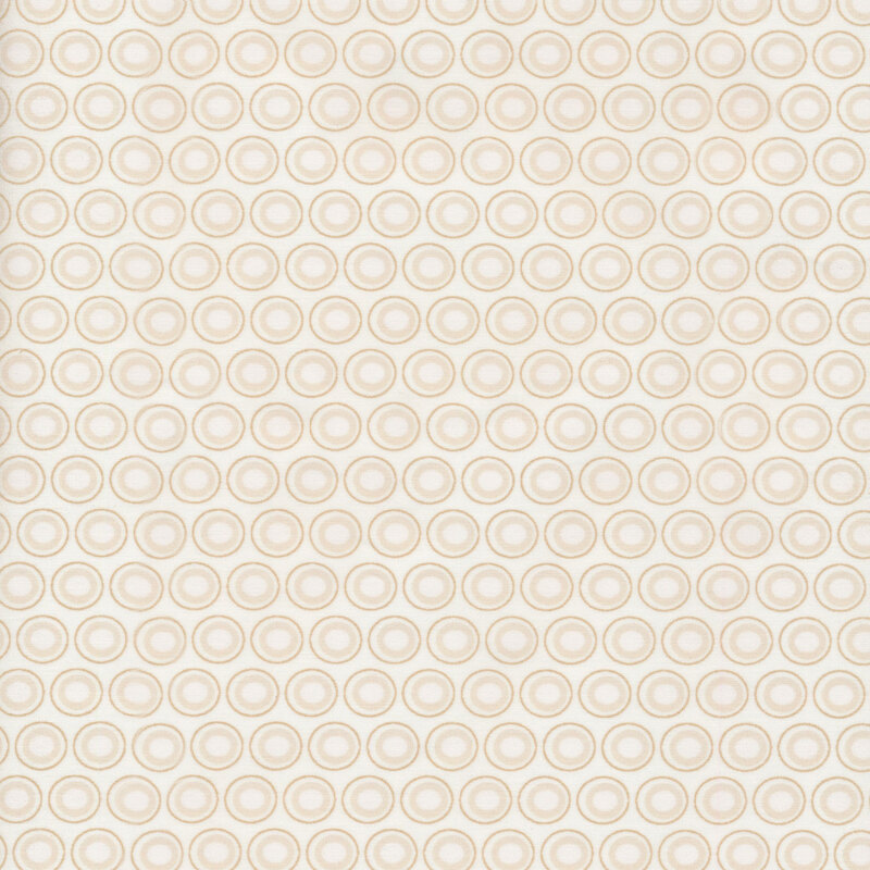 Off-white fabric with a lovely cream and light beige oval polka dot design