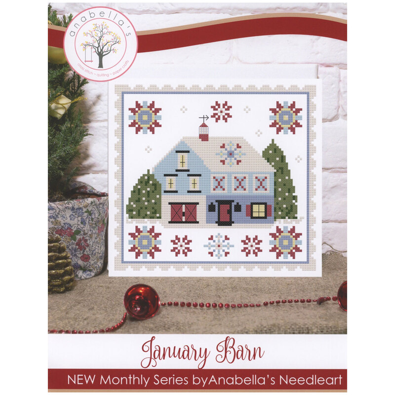 Front of pattern showing a digitized version of the finished project, staged beside a small tree and winter decor.
