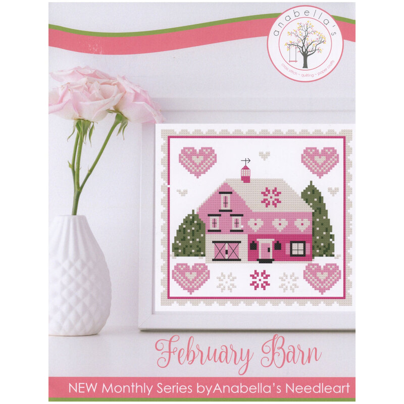 Front of pattern showing a digitized version of the finished project, staged in  a white frame beside a white vase with pink roses.