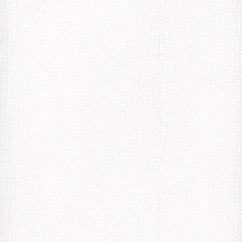 White fabric with irregular lines of small white dots close together