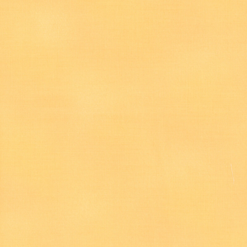 Mottled creamy yellow fabric
