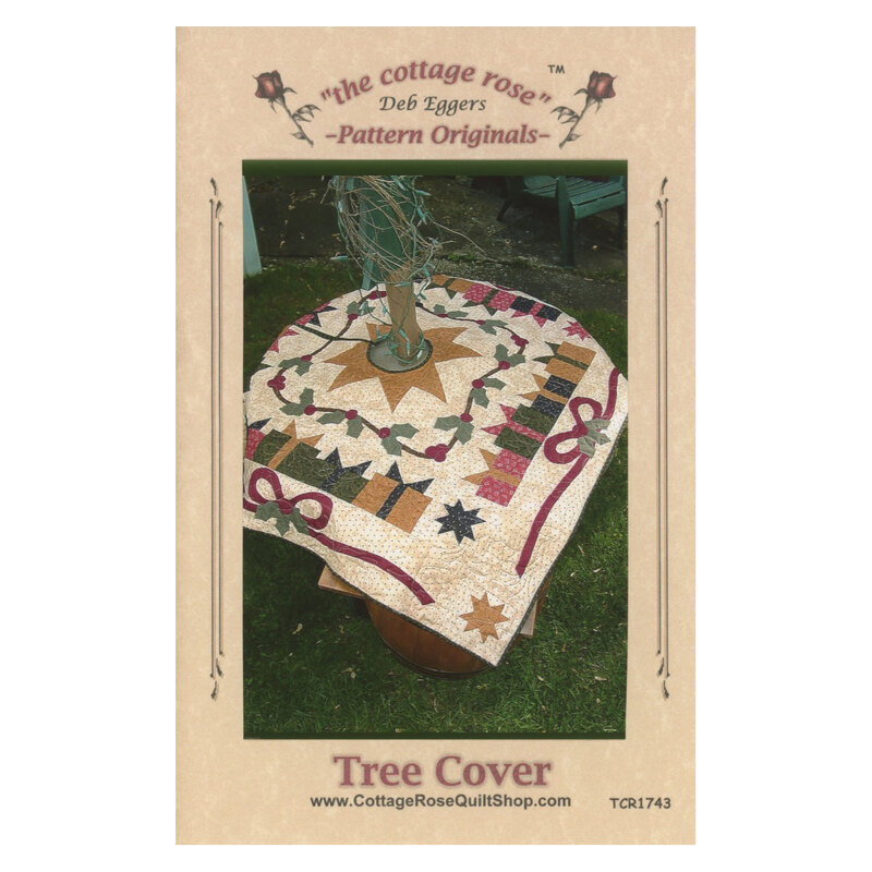 Front cover of pattern featuring a photograph of the completed tree cover, staged outdoors under a decorative tree.