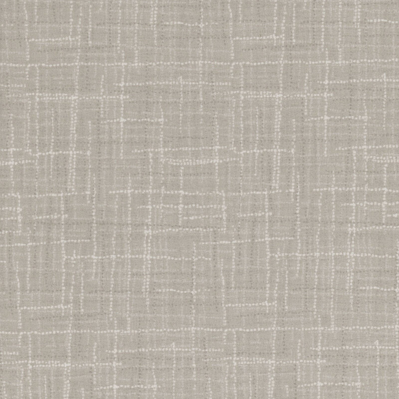 Photo of tonal gray fabric featuring textured lines and dots