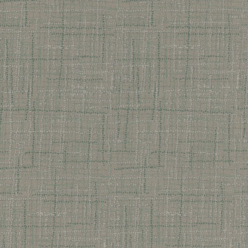 Photo of gray fabric featuring textured lines and teal dots