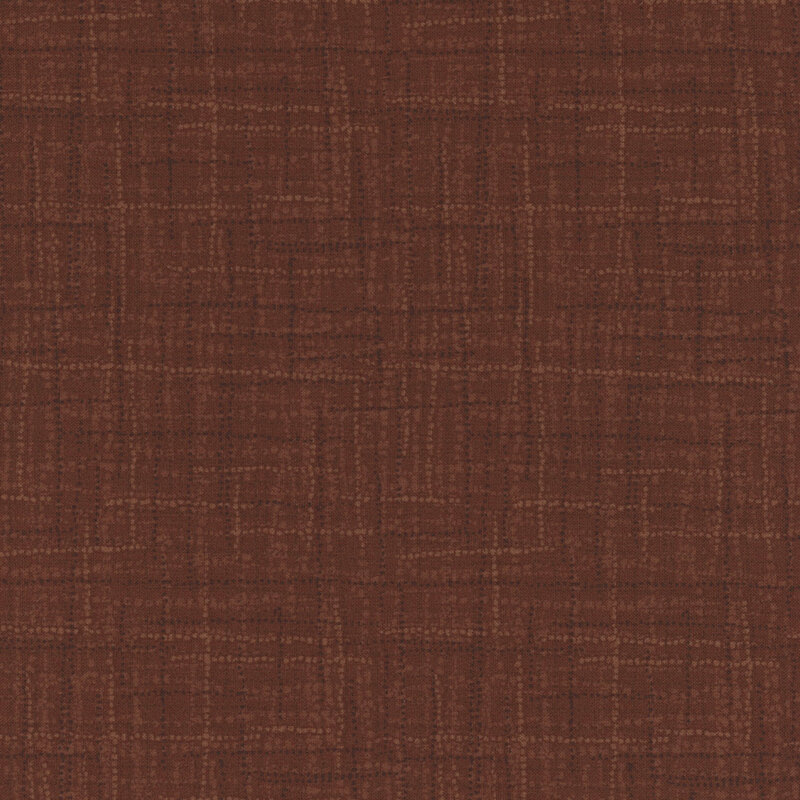 Photo of tonal brown fabric featuring textured lines and dots