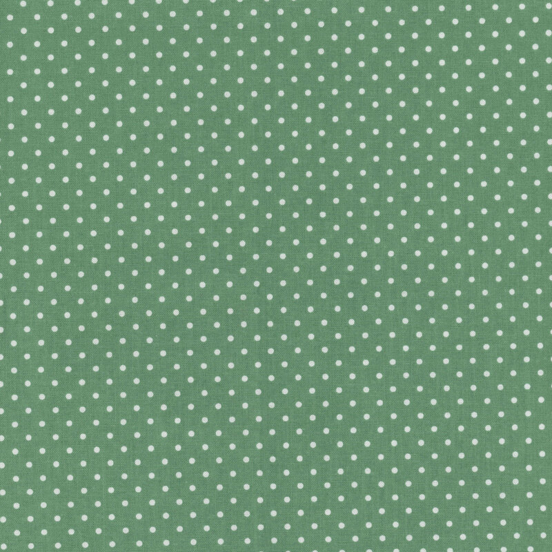 Green fabric with white polka dots.