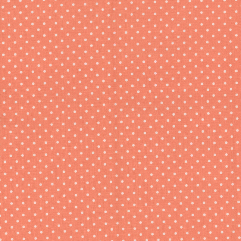 Digital render of a peachy fabric with white polka dots.