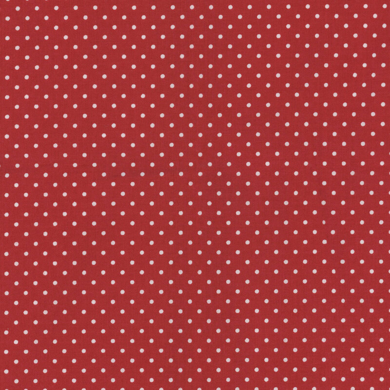 Deep red fabric with white polka dots.