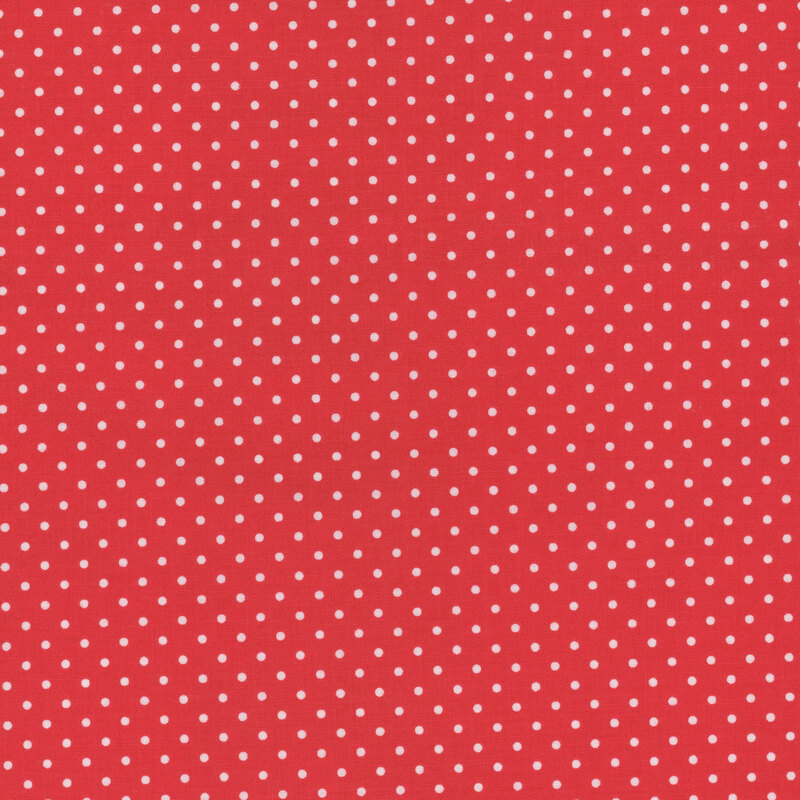 Poppy red fabric with white polka dots.