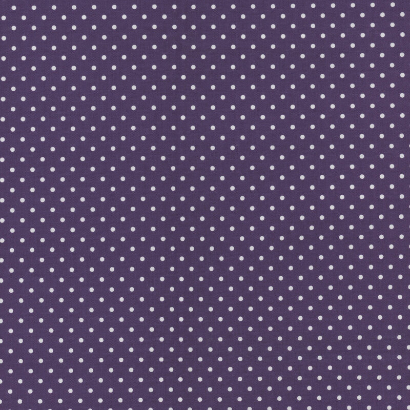 Purple fabric with white polka dots.