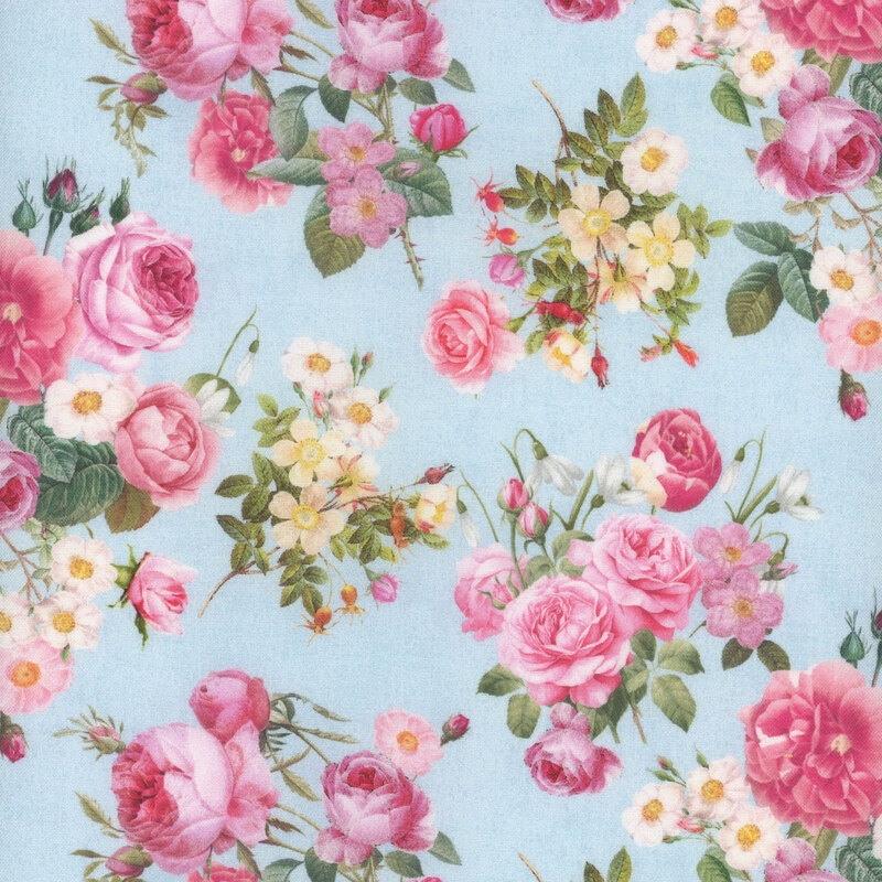 Fabric with a pattern of bouquets of roses, snowdrops, apple blossoms, and red buds on a blue background.