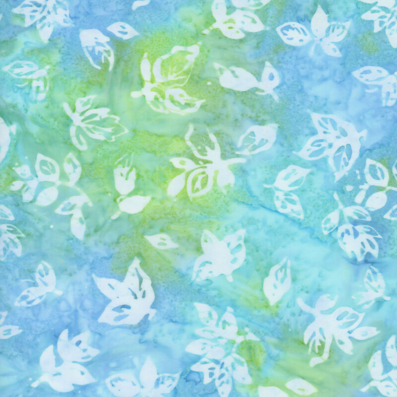 Blue and green mottled fabric with white leaf silhouettes all over