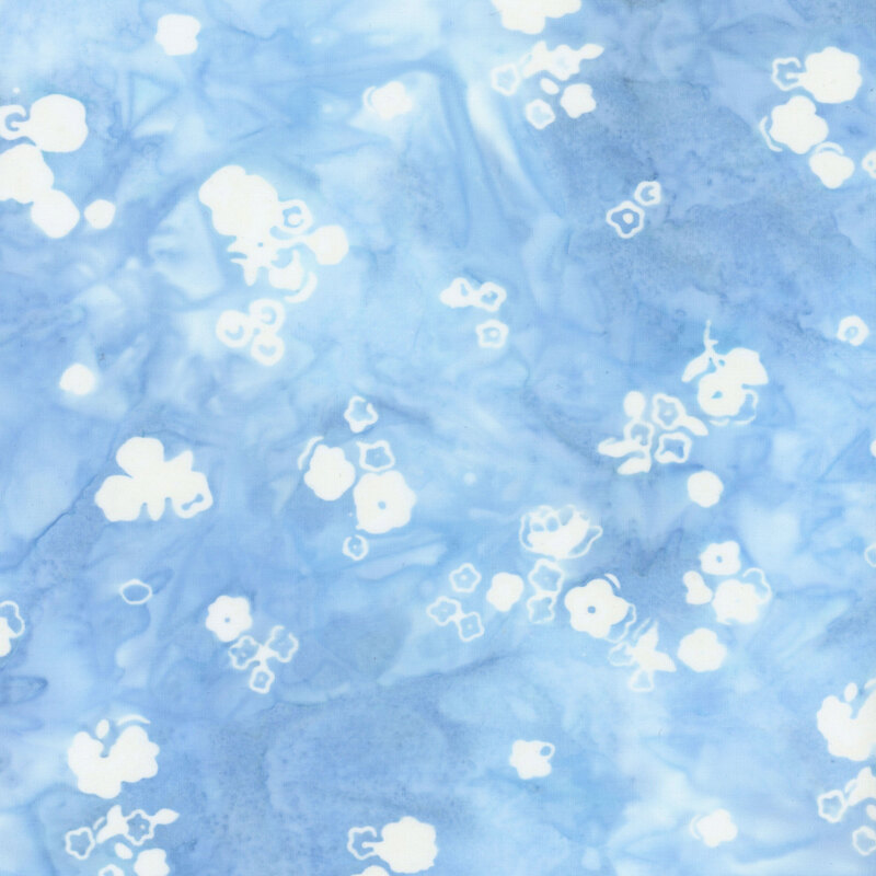 Light blue mottled fabric with tossed white floral silhouettes all over