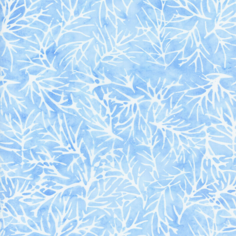 Light blue mottled fabric with tossed white branch silhouettes all over