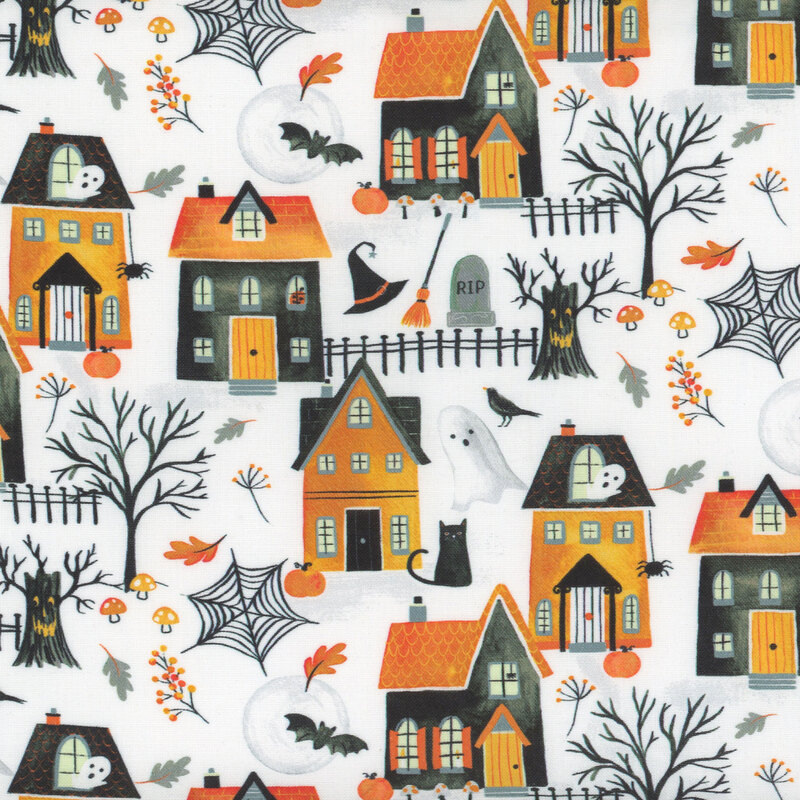 White fabric with orange and black haunted houses and ghosts, cats, crows, and spiders.