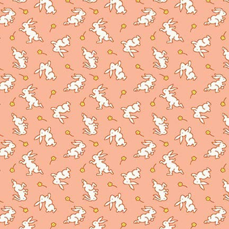 Peach-colored fabric with white bunnies and small yellow daisies.