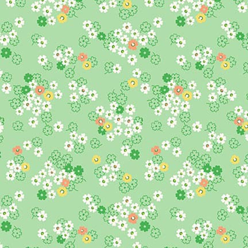 Green fabric with white daisies with yellow and orange accents.