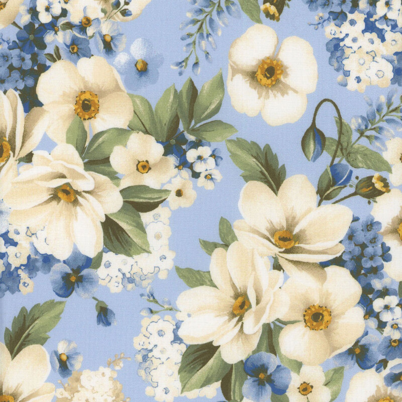 Light blue fabric with white and blue flowers in clusters with green leaves all over