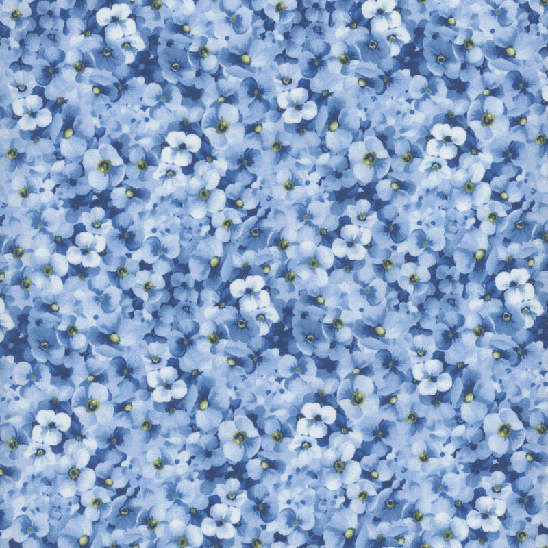 Fabric featuring small packed blue flowers in varying shades