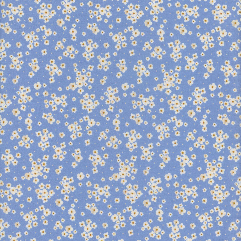 Blue fabric featuring tossed small white flowers