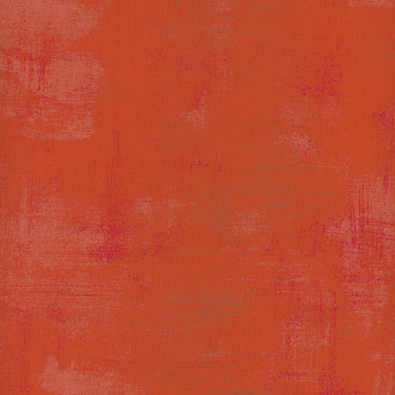 Warm and bright orange fabric with red and sandy texturing