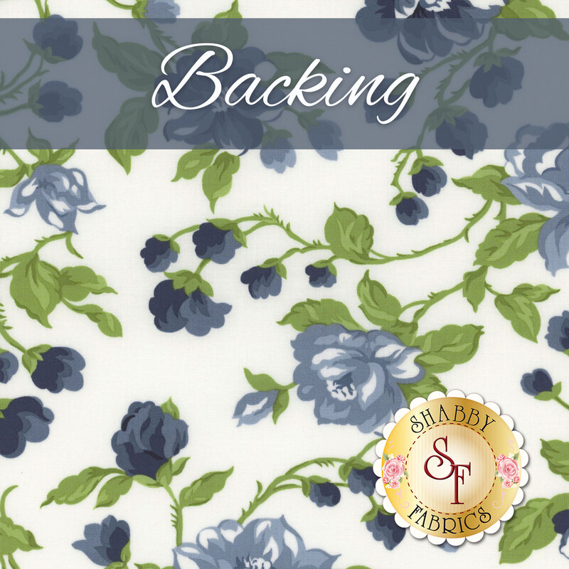 A white fabric with sprawling green and blue florals. A banner at the top reads 