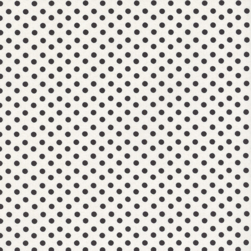 Black polka dots on white fabric.