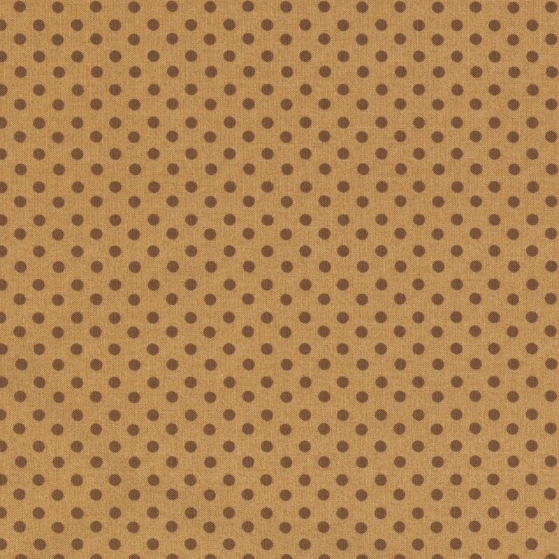 Brown polka dots on tan fabric.
