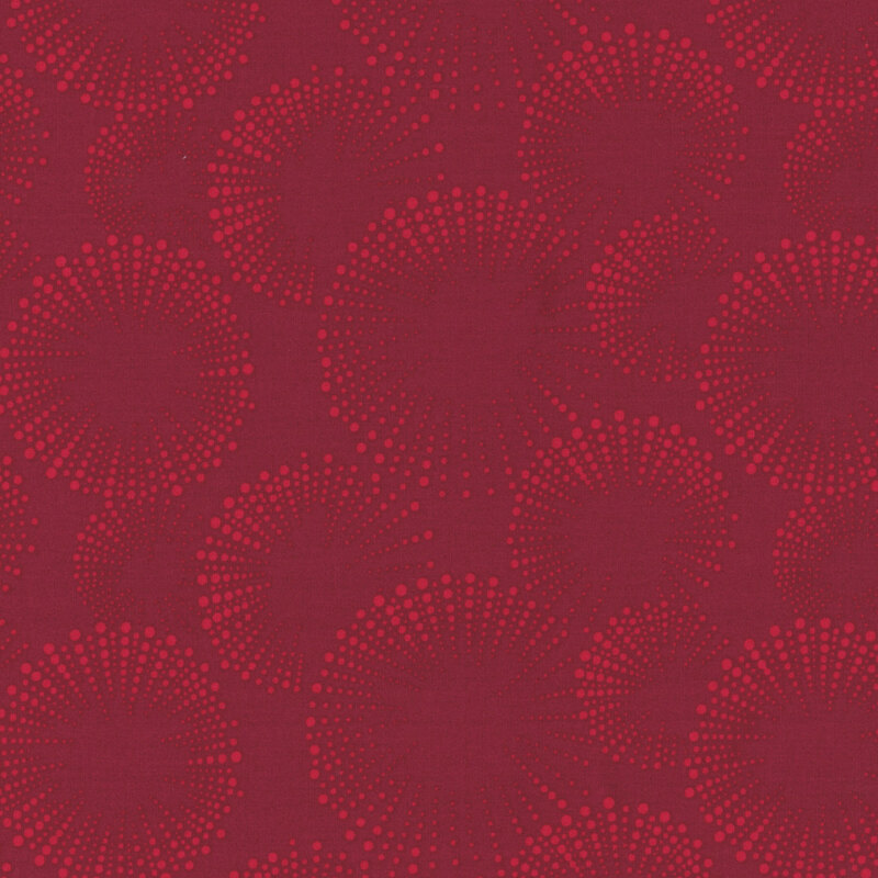 Deep burgundy fabric with dotted fireworks in red.