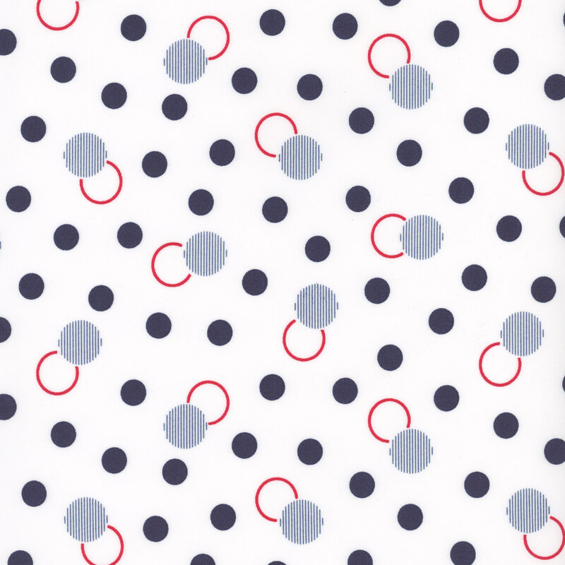 White fabric with dots and circles in red and navy.