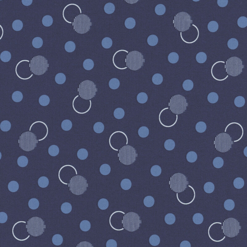 Navy fabric with dots and circles in blue and white.