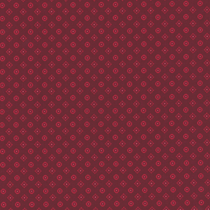 Deep burgundy fabric with tonal red diamonds and rounded squares all over