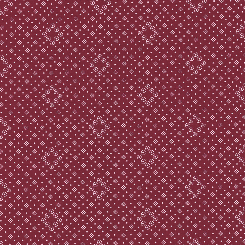 Deep burgundy fabric with tiny white dotted diamonds in a geometric design.