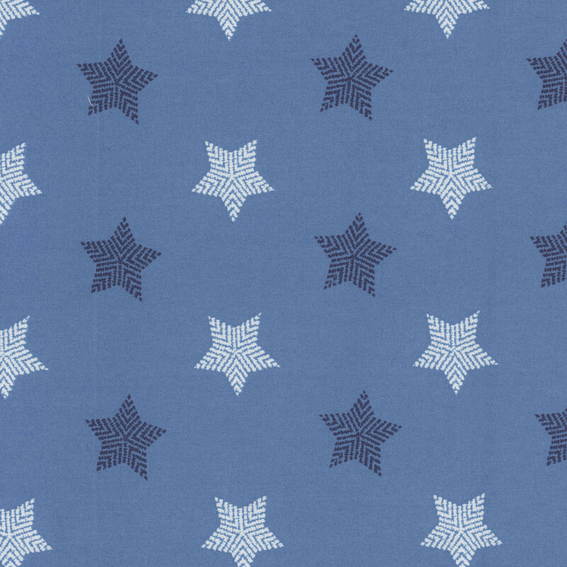 Denim blue fabric with large striped white and dark blue stars all over