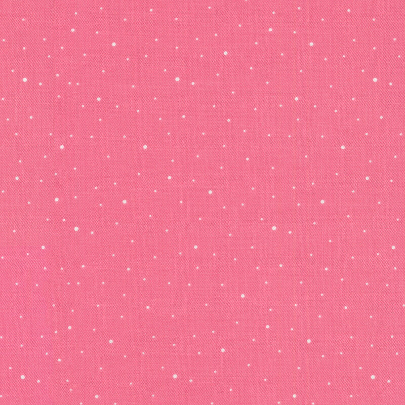 pink fabric with scattered white polka dots
