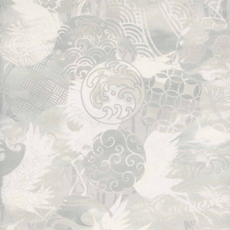 gorgeous cream fabric featuring scattered circles with different patterns in mottled shades of cream, and the occasional crane flying through the circles