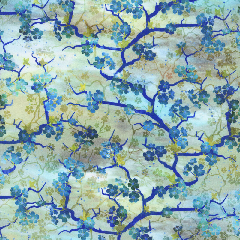beautiful light blue and teal mottled fabric featuring blue flowering cherry blossom branches