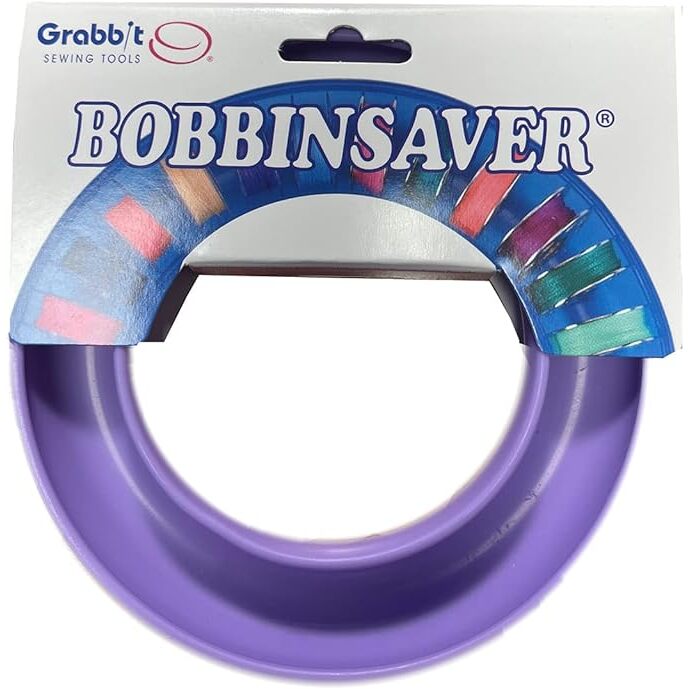 The lavender BobbinSaver in its packaging, isolated on a white background.