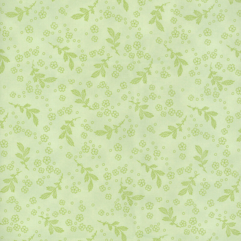 Vivid green fabric with light green leaf sprigs and small flowers.
