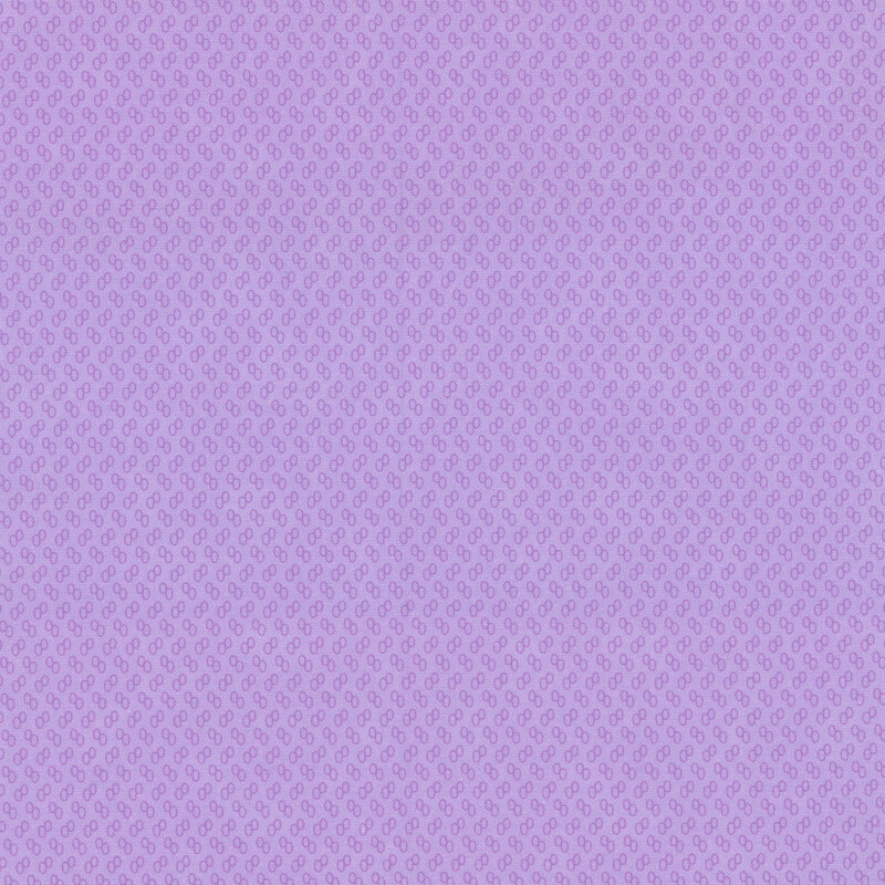 Light purple fabric with tiny purple ovals.