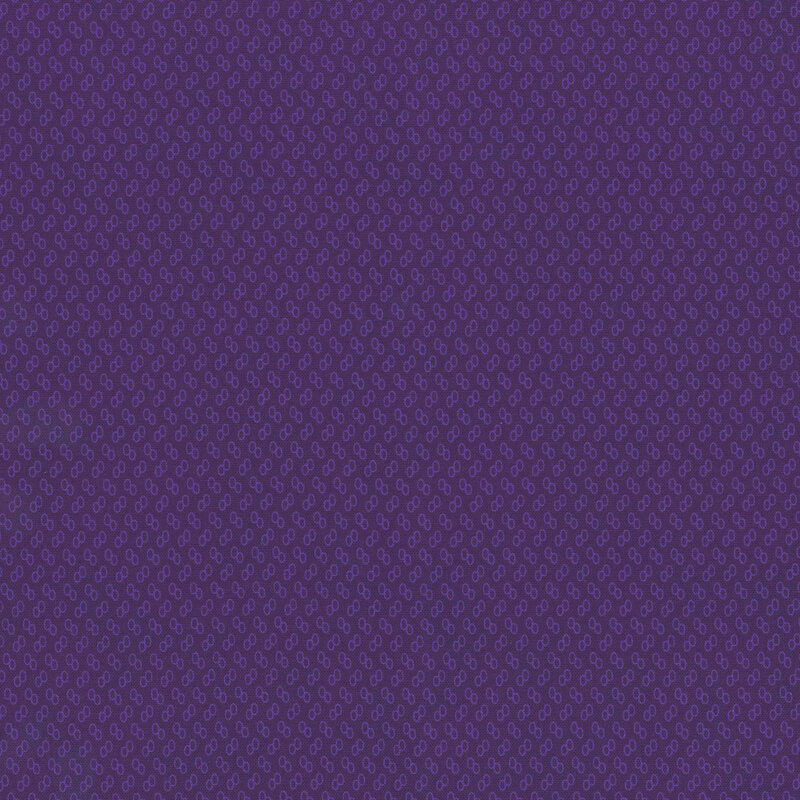 Dark purple fabric with tiny purple ovals.