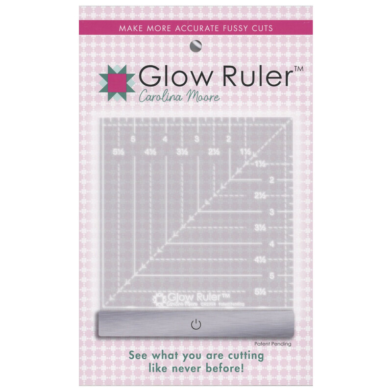 The glow ruler in its light pink packaging, isolated on a white background.