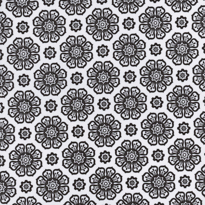 White fabric with black floral motifs evenly spaced apart