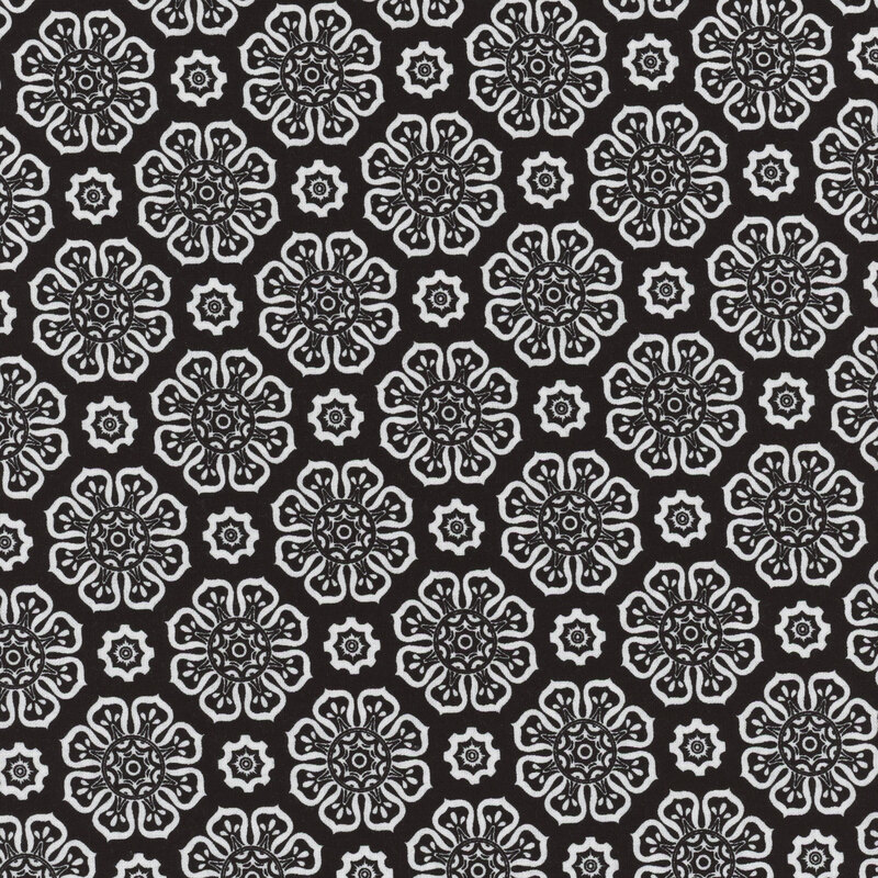 Black fabric with white floral motifs evenly spaced apart