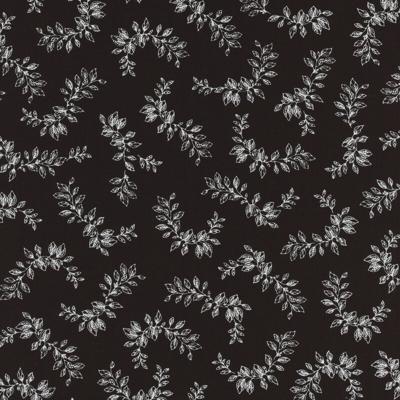 Black fabric with white leafy vines tossed in curved shapes all over
