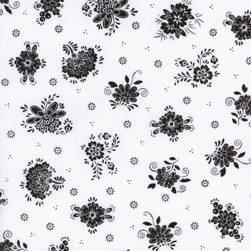 White fabric with clusters of black flowers spaced evenly apart