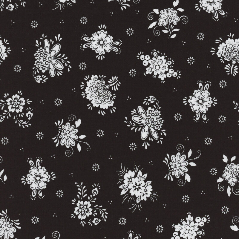 Black fabric with clusters of white flowers spaced evenly apart