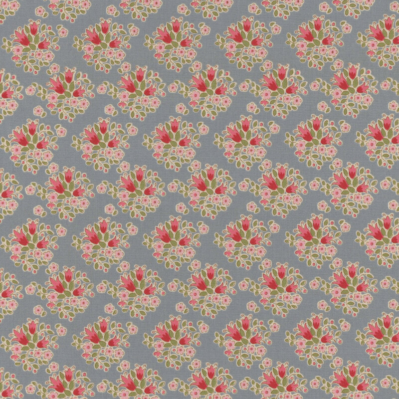 Blue fabric with clusters of upright red and pink flowers with green leaves