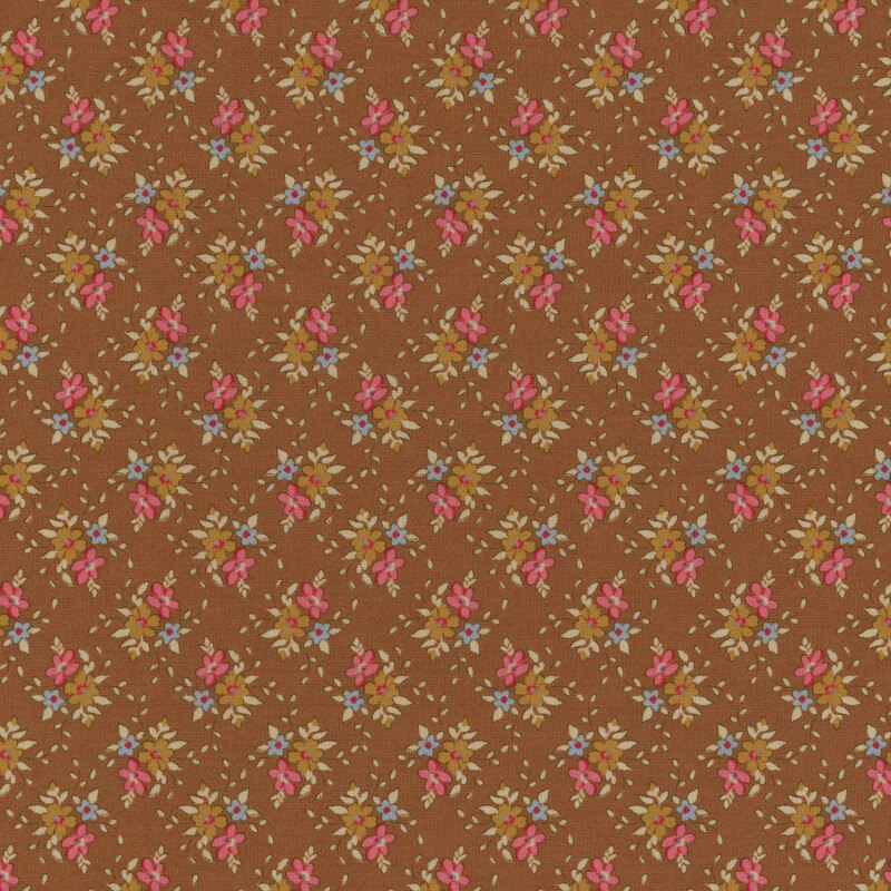 Brown fabric with clusters of pink, blue, and brown flowers with cream leaves