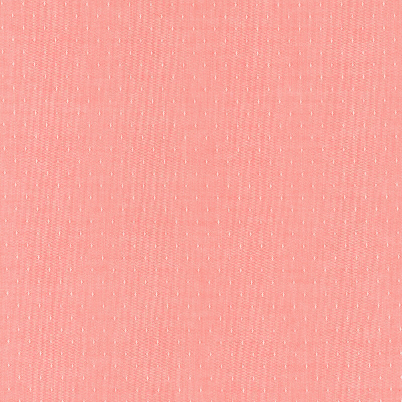 Pink woven fabric with dot accents woven into it